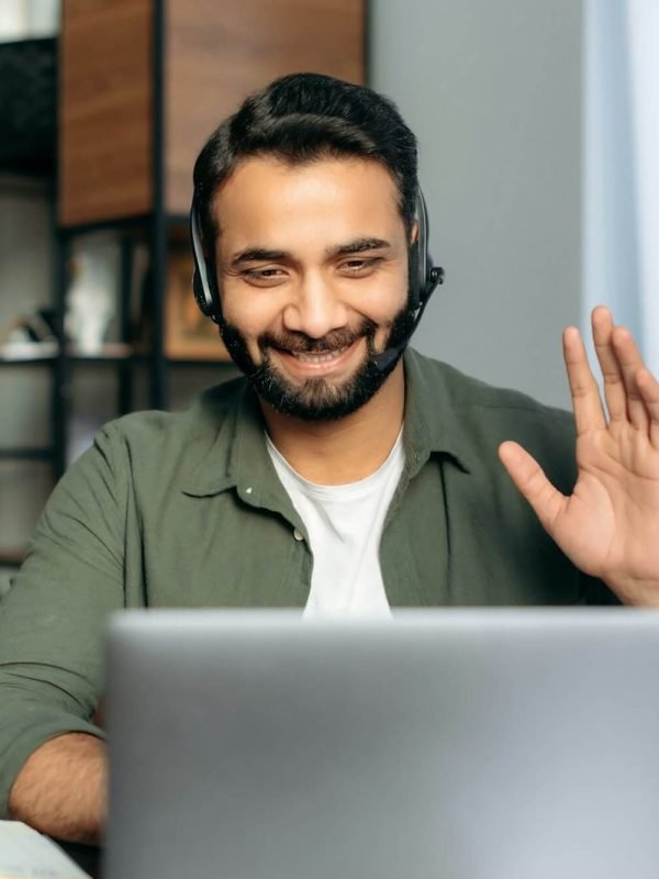 positive-attractive-indian-guy-in-headphones-hotline-operator-support-worker-online-consultant.jpg